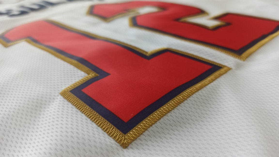 Detailed stitching on a ujersey name and number